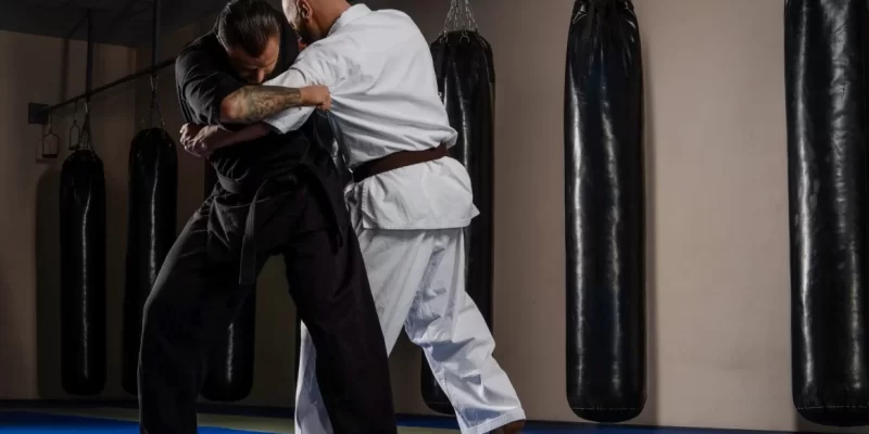 two-karate-fighters-in-kimono-showing-technical-sk-2025-01-26-04-03-24-utc