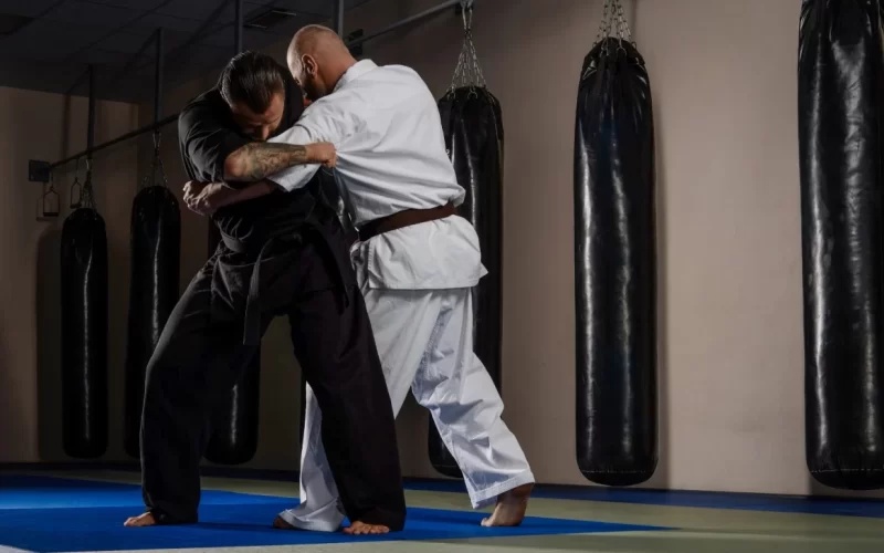 two-karate-fighters-in-kimono-showing-technical-sk-2025-01-26-04-03-24-utc